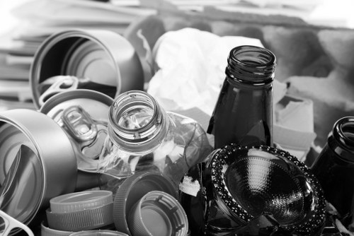 Waste collection vehicle at a commercial site exterior