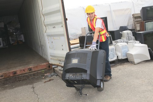 Workers sorting commercial recyclables at a local transfer station